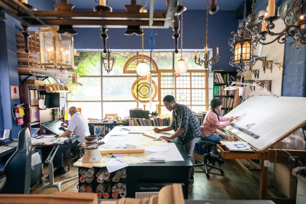 Wide shot of a Team of architects working in the studio on a home renovation project