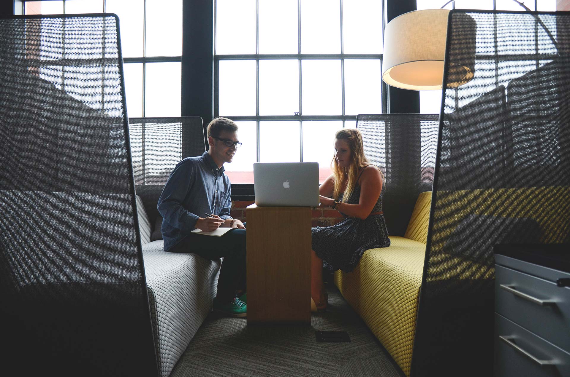 Two people collaborating in a modern office